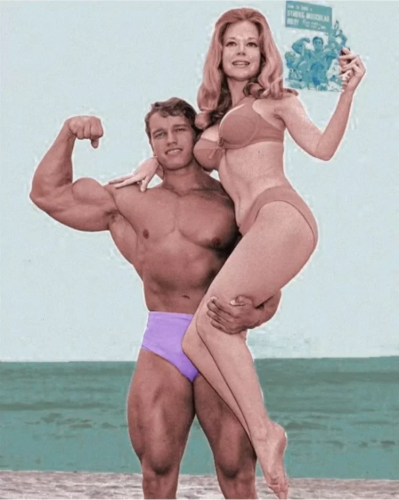 Arnold at beach with girlfriend