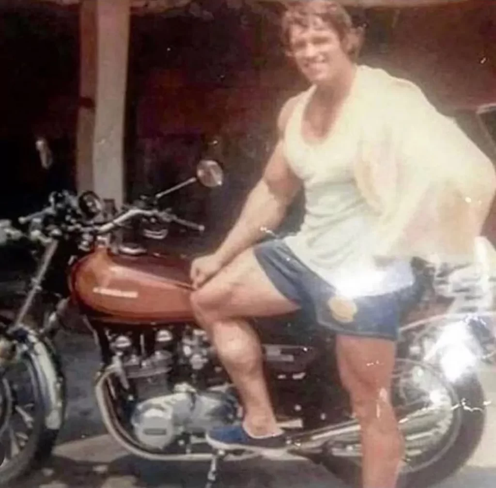 Arnold looks cool at his motorcycle