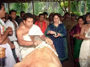 sachin and his wife anjali at temple